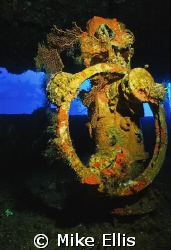 The helm of the Nippo Maru in Truk lagoon. Nikonos V w/ 1... by Mike Ellis 